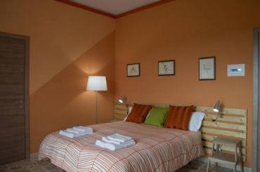 Улучшенный двухместный номер с 1 кроватью или 2 отдельными кроватями, балконом и видом на вулкан Этна.